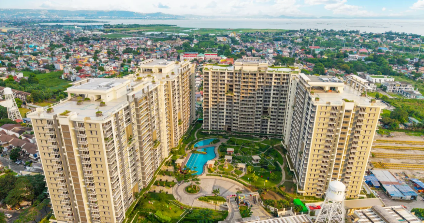 Alder Residences with landscaped open spaces and a view toward Laguna de Bay